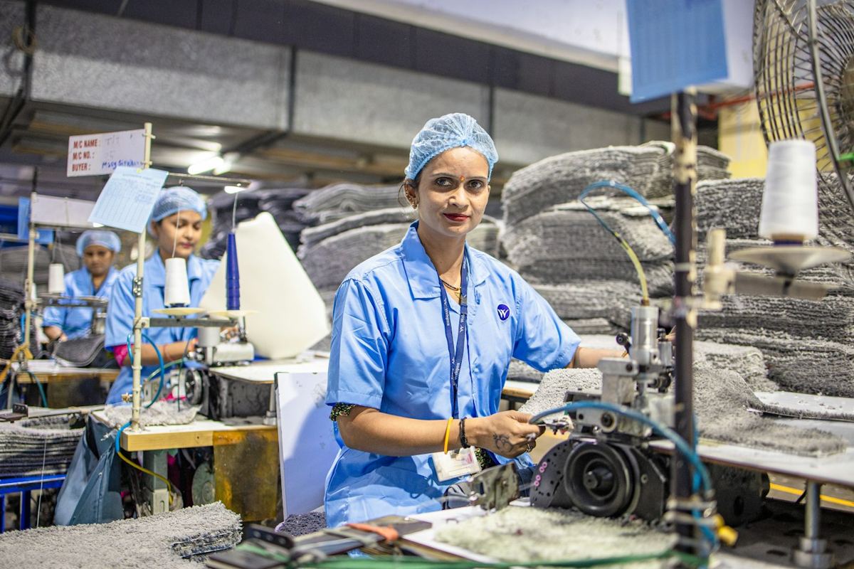 A machine operator on a factory floor